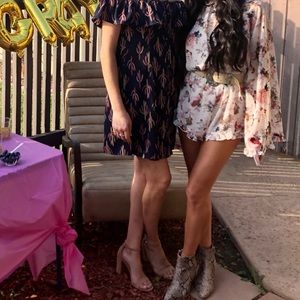 Floral open back long sleeve romper size S